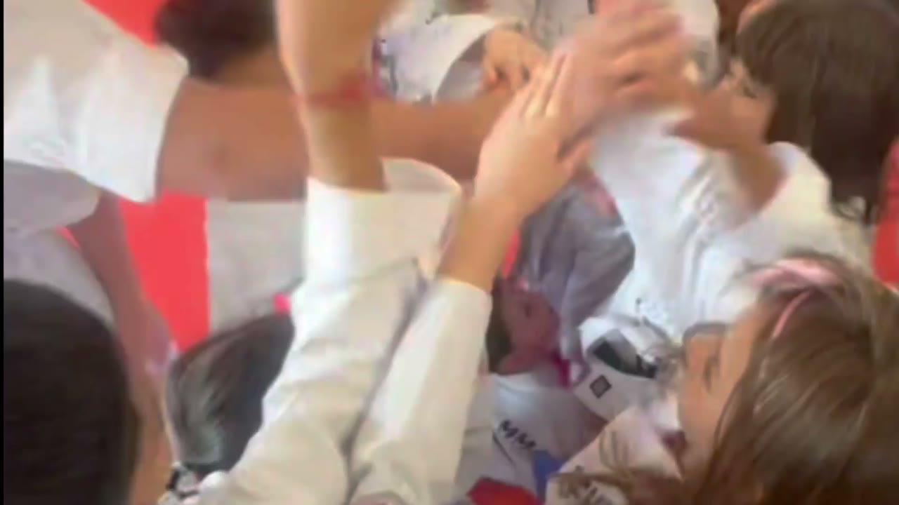 Children huddling together during a Kaizen Kids session